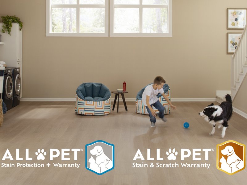 Mohawk Flooring All Pet Ad featuring a child and dog playing in an open room